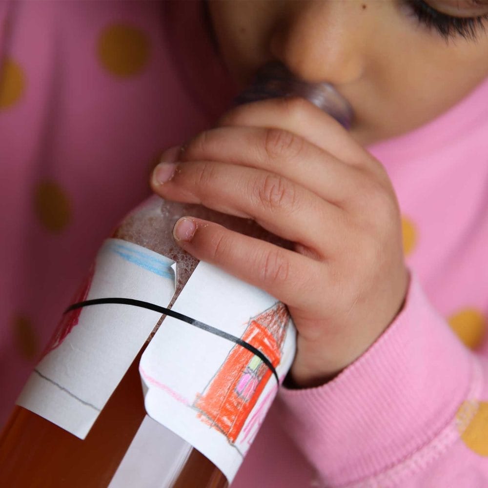 A child tries it at MILK. The first taste of apple juice at mealtime.