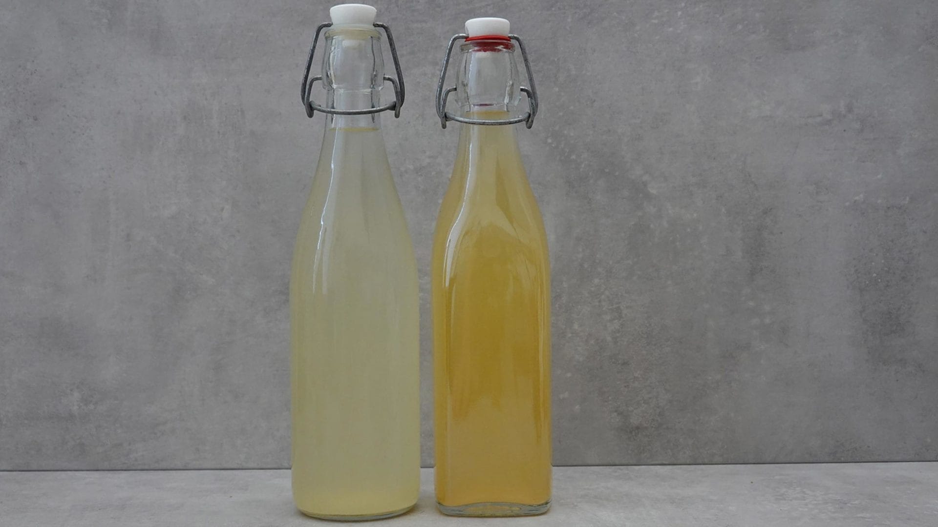 Two iron bottles of ginger beer