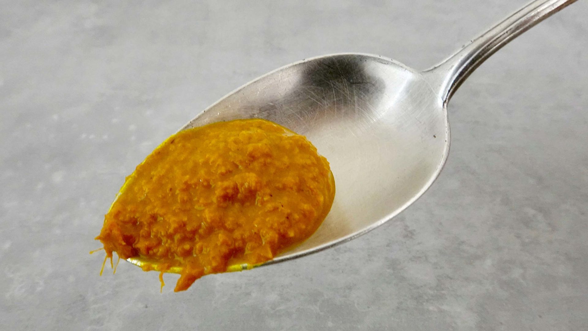Golden Milk - turmeric paste on spoon