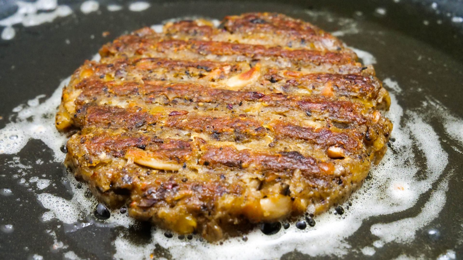 The finished patty is fried in the pan