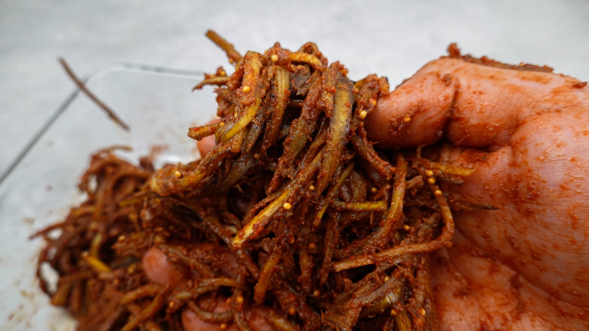 Marinated banana peels in one hand